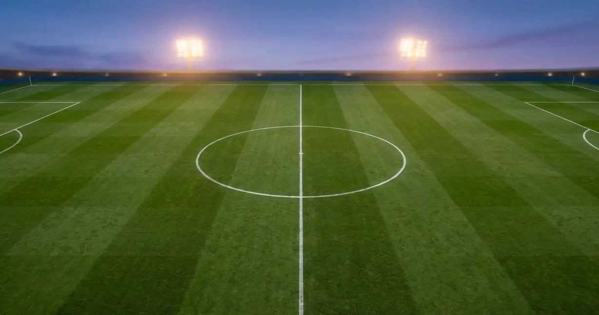 Campo da calcio visto dall'alto con linee di demarcazione nitide, che evoca il concetto di handicap nelle scommesse